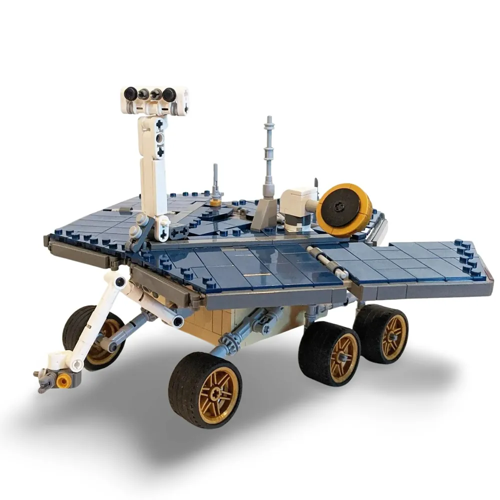 A toy rover with six wheels, solar panels, and a camera is displayed.