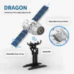 A toy spacecraft with rotating solar arrays, an openable sensor hatch, and a separable stand.
