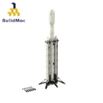 A white and black toy rocket with several small black pieces on the side.