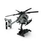 A gray and black toy helicopter is displayed on a black stand.