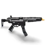 A black and gray toy gun with a gold-colored tip, made of interlocking bricks, is displayed.