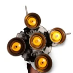 A toy with five yellow cylindrical pieces is attached to a dark gray base.