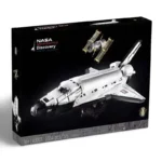 A box containing a toy space shuttle and satellite is displayed.