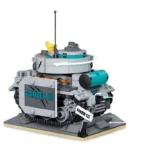 A gray and teal toy tank with a rotating turret and a small yellow bird on top sits on a gray base.