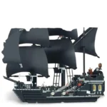 Black toy ship with multiple sails and ladders.