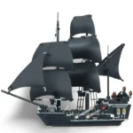 A black toy ship with multiple black sails is visible.
