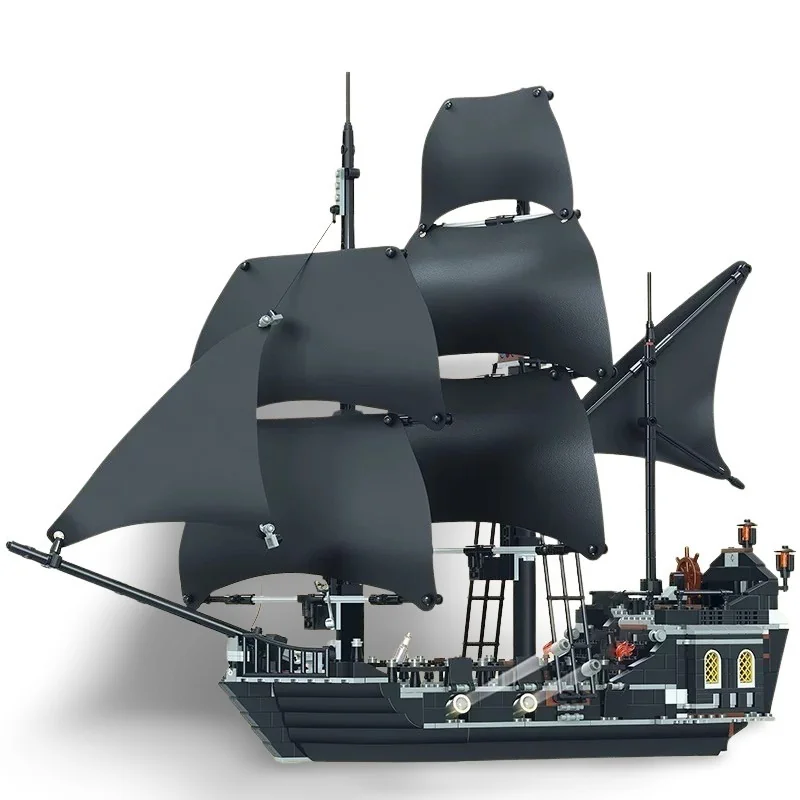 A black toy ship with multiple black sails is visible.