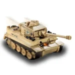 A tan toy tank with black markings and a long barrel is shown in motion.