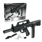 Black toy gun made of building blocks with additional blocks and bullets near it.