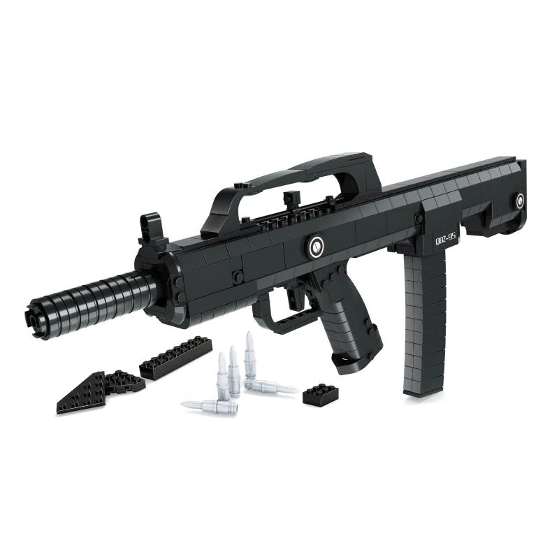 A black toy gun with several toy bullets and additional black bricks on a white surface.