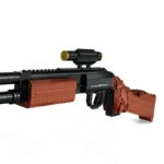 A toy gun made of interlocking bricks with a scope is displayed.