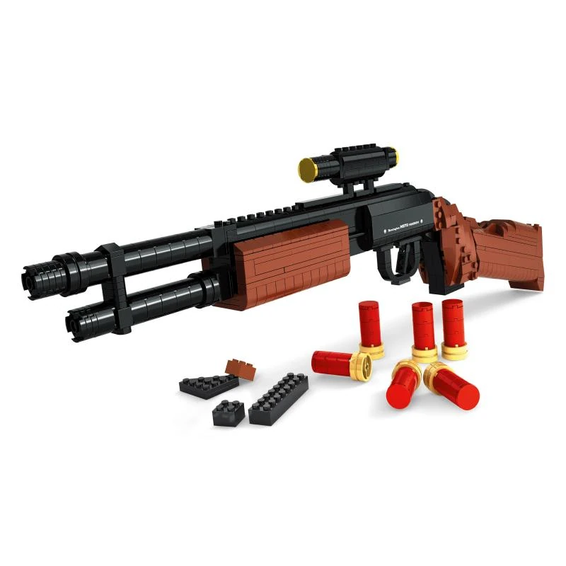 A toy gun with a scope, several red and gold toy bullets, and some black and brown toy blocks are displayed.
