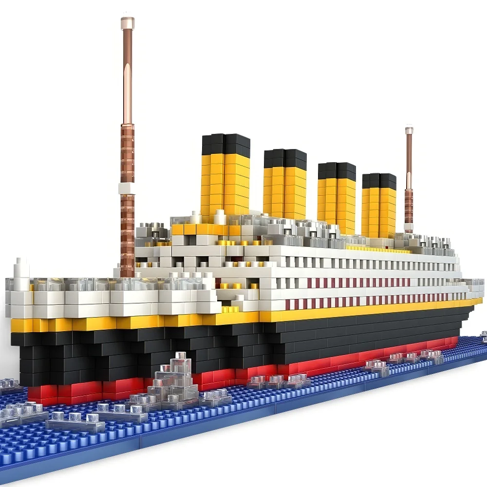 A toy ship model with black, yellow, red, and white blocks is on a blue base.
