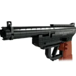 A black and brown toy gun made of interlocking bricks is displayed.