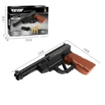 A toy gun made of black and brown bricks is displayed with its packaging and dimensions.