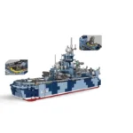 A toy warship with blue and grey camouflage pattern and the number 615 on its side.