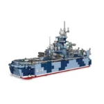 A toy warship with a blue camouflage pattern and number 615 on its side.