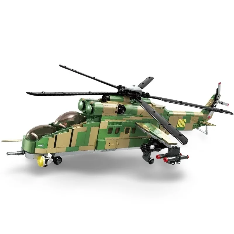 A toy helicopter with green and tan camouflage pattern has black rotors and red missiles.