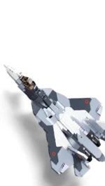 A gray and white toy jet with red stars is angled against a white background.