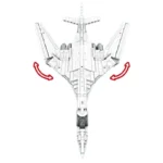 White toy airplane with movable wings, viewed from above, with red arrows indicating wing movement.
