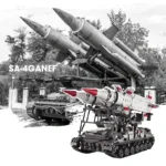Two toy military vehicles with missiles are displayed.