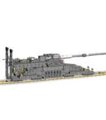 A grey toy artillery piece sits on a tan track.