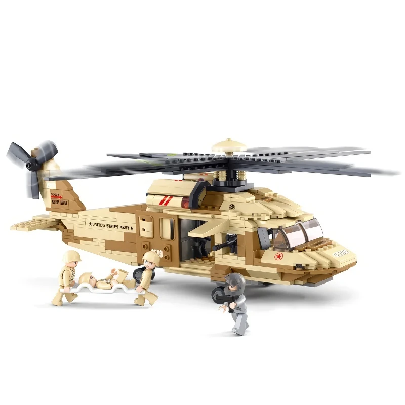 A toy helicopter with four figures, two carrying a stretcher, and one figure standing nearby.