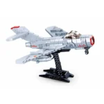 A gray toy airplane with red accents is displayed on a black stand.
