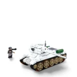 A white toy tank and a gray toy figure with a black scarf are visible.
