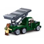 A green toy truck with a gray rocket launcher and two toy figures.