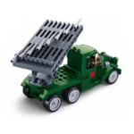 A green toy truck with a gray missile launcher mounted on its back.