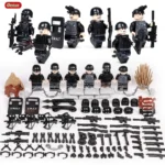 A set of toy figures in black uniforms, along with weapons, shields, and other accessories.
