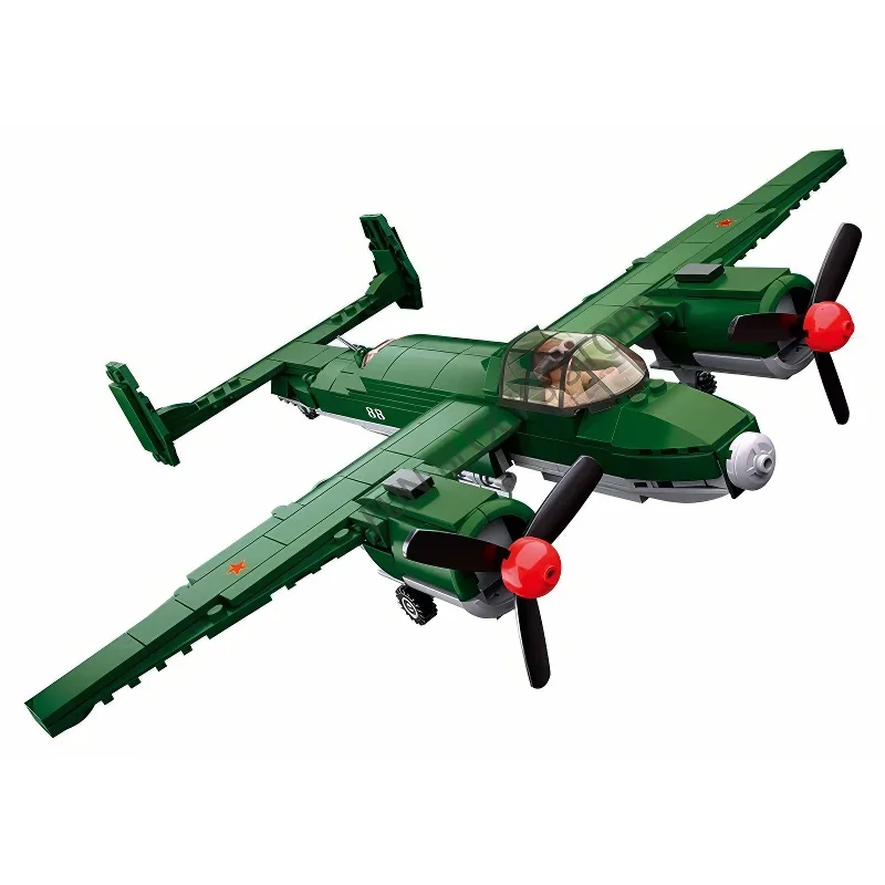 A green toy airplane with two propellers and a red star on the wing.