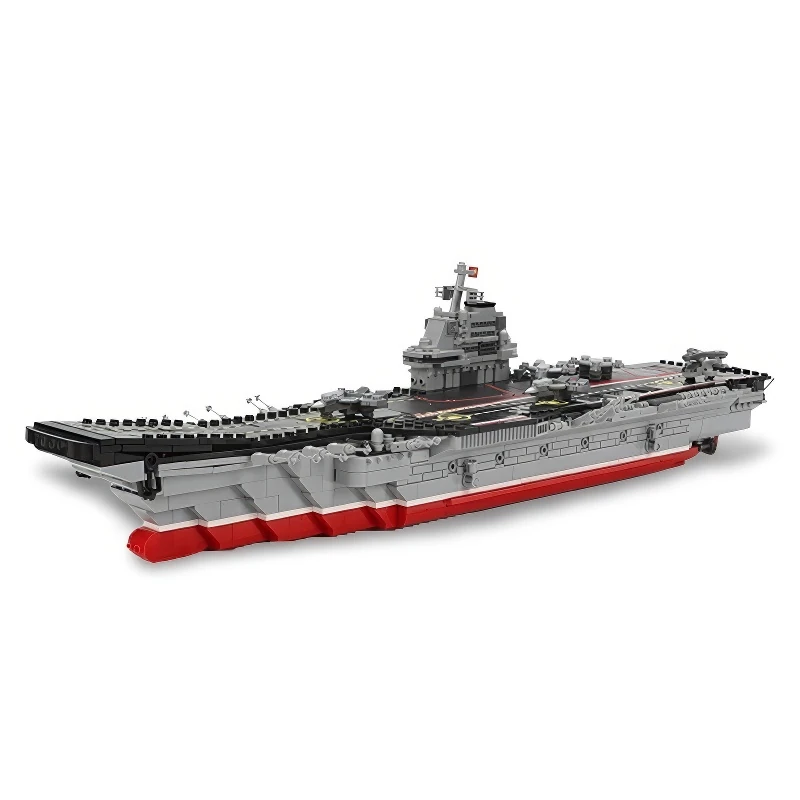 A gray and red toy aircraft carrier is displayed.