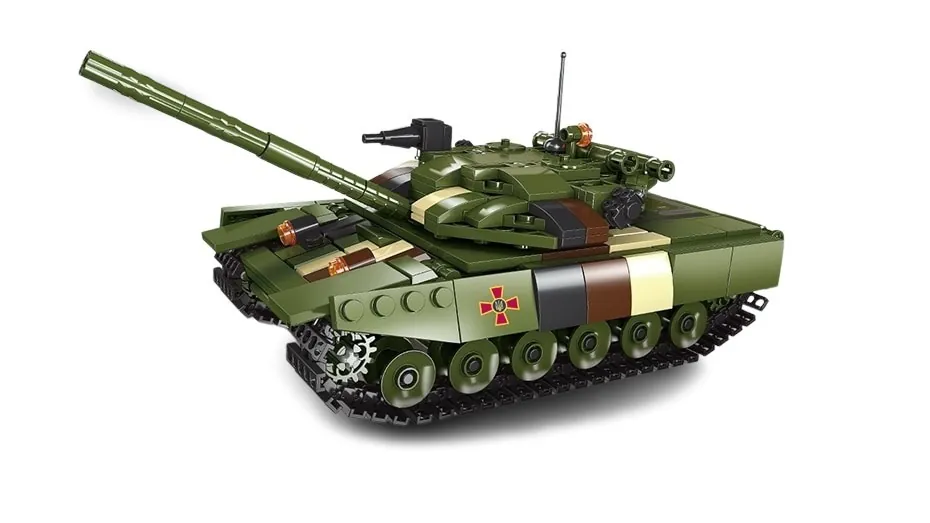 A green and brown toy tank with a long barrel and a red cross emblem.