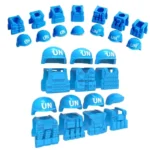 Blue toy helmets and vests with "UN" printed on them are arranged in rows.