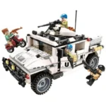 A white toy vehicle with three figures, one on a red motorcycle, and two holding guns.
