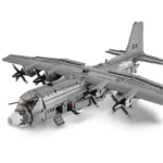 A gray toy airplane with four propellers and the words "AIR-GUNSHIP" on its side.