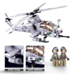 A gray toy helicopter with two toy figures standing next to it.