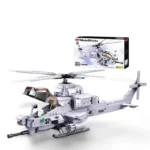 A gray toy helicopter with a number 57 on its side and a box in the background.