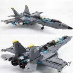A gray toy jet with yellow accents is displayed in two different views.