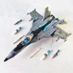 A gray toy jet with several missiles is displayed on a light surface.