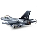 A gray toy jet with black tail and visible jet engine.