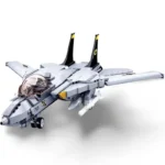 A gray toy jet with black tail fins, a clear cockpit, and white missiles is displayed.