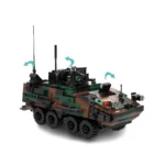 A toy military vehicle with eight wheels and camouflage pattern is shown.