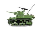 A green toy tank with a star on its side and a black machine gun on top.