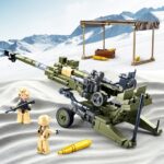 A green artillery cannon with two figures and several gold projectile pieces are displayed.