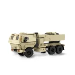 A tan brick toy truck with black wheels is visible.