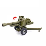 A green toy artillery piece with a long barrel and two wheels.