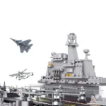 A toy aircraft carrier with several toy helicopters and a toy jet are visible.